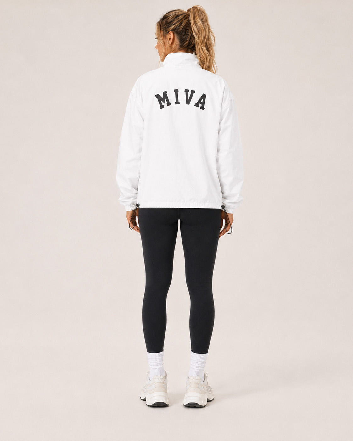 MIVA Pullover Windbreaker in White, back with arched MIVA wordmark
